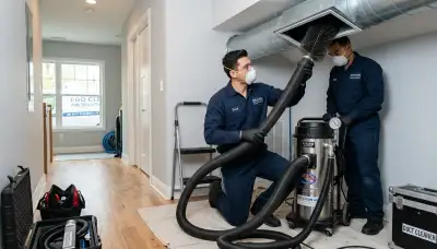 Technician cleaning air ducts for HVAC system in Tucson AZ home by Five Star Cooling